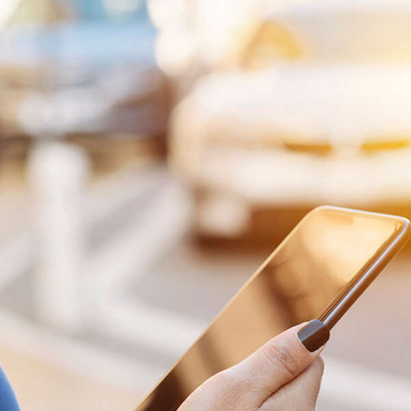 Blog view of a smart phone hands female requesting a ride share 1591716301