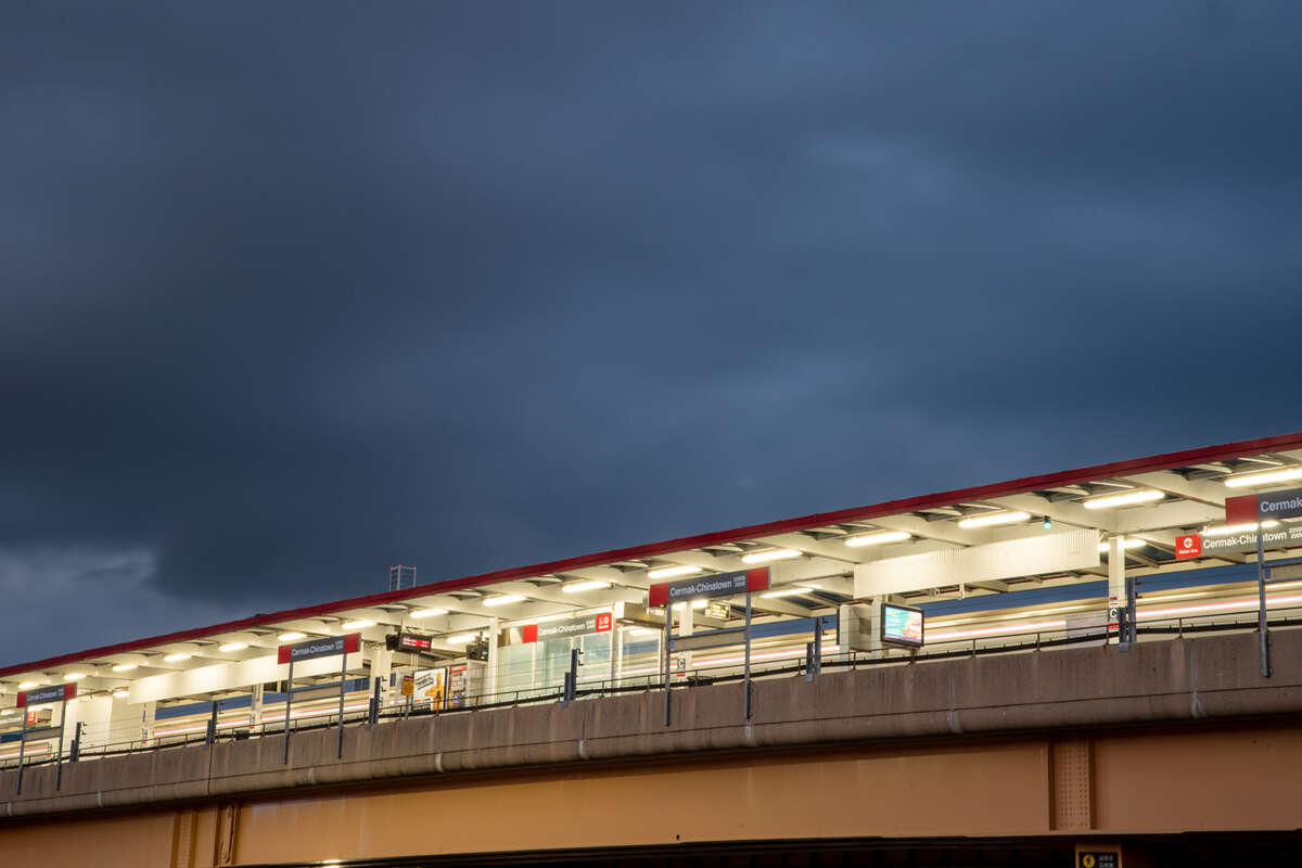 View of Red Line platform from above shining brightly in the night.